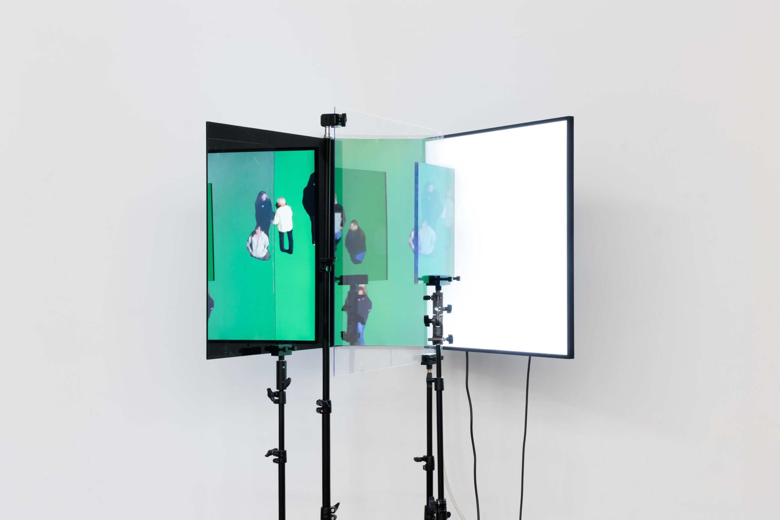 Emmanuel Van der Auwera, Medusa 12.14.12, 2025, Square 33.2 inch LCD screen, polarization filter, plexiglass, tripods, HD video. Duration 15 mins 30 sec, 190 x 100 x 100 cm - 74 3/4 x 39 3/8 x 39 3/8 in. Photo credit: the artist
