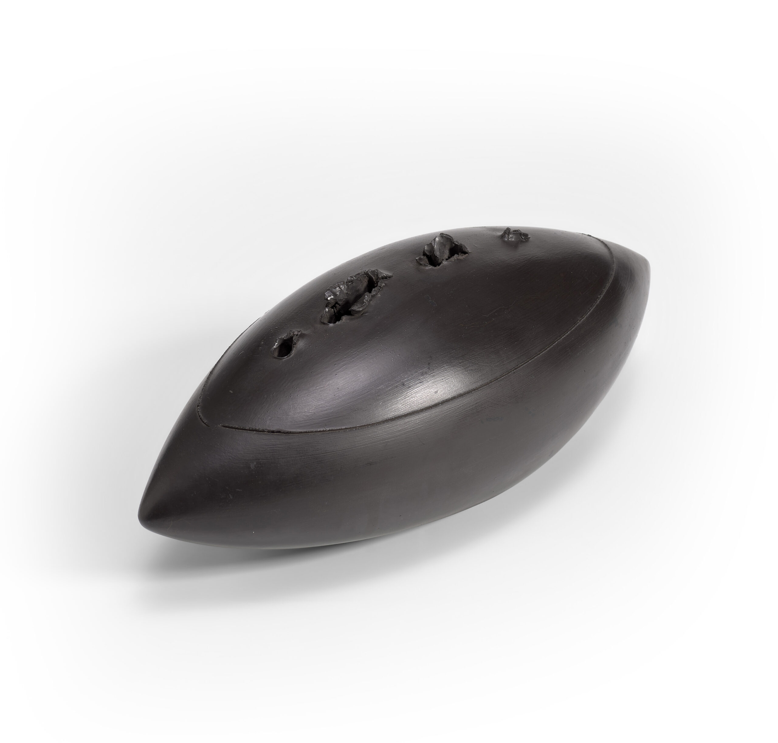 Lucio FONTANA (1899 – 1968)
Concetto Spaziale Ovale
1968
black glazed porcelain with holes
16.6 x 44.5 x 18 cm
Ed.  9 of 75