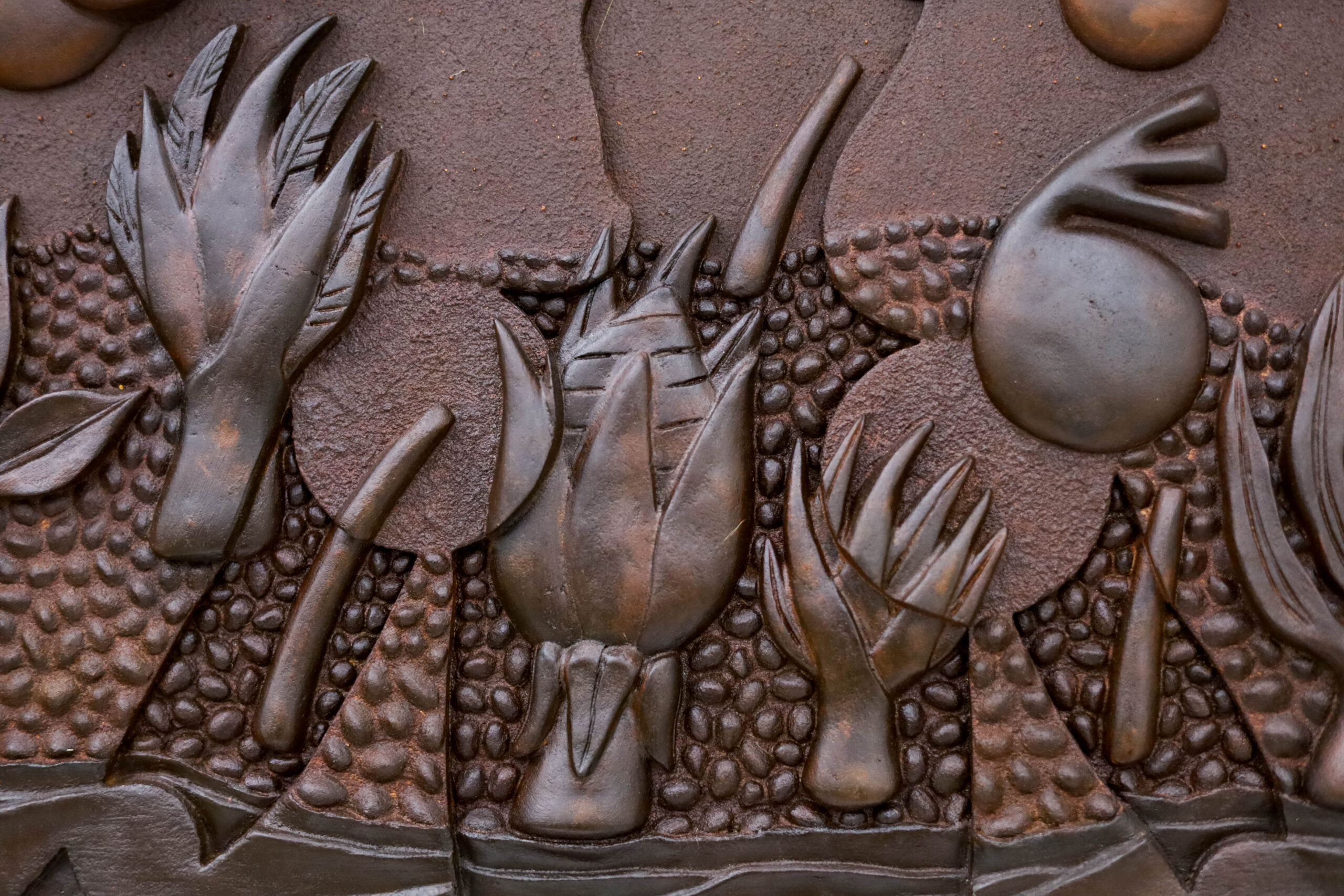 Crossing to Gimukodan, leather varnish on sawdust and white glue, on carved wood, 82.8 x 66.5 cm, 2024